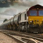 Train - yellow and black train on railways