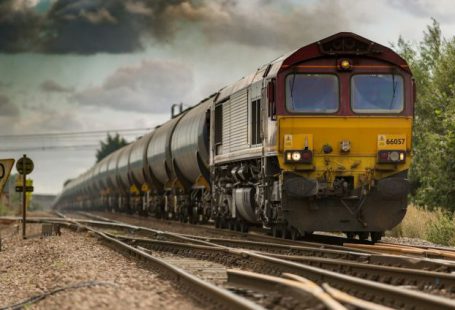 Train - yellow and black train on railways