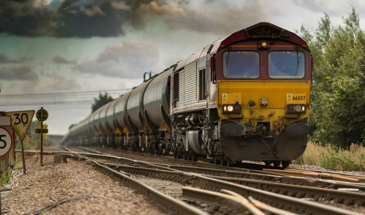 Train - yellow and black train on railways
