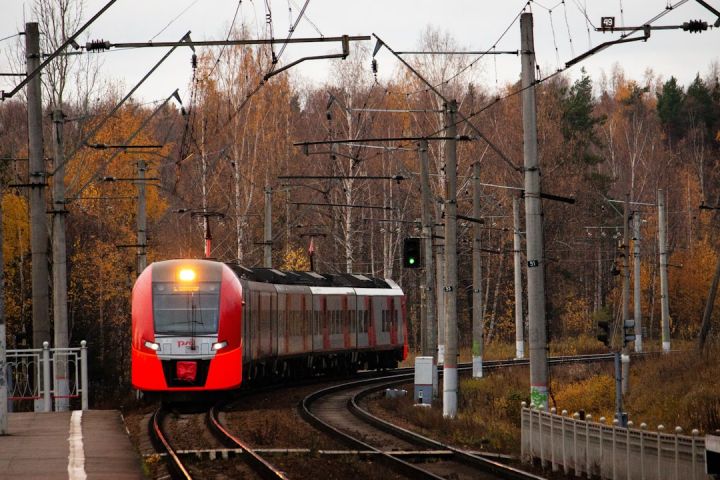 Train - orange train on railroad during daytime