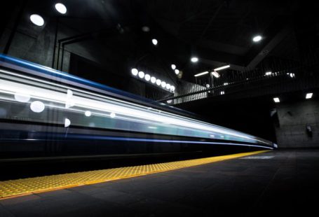 Train - timelapse photography of train passing on track