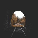 Train - low-light photo of railroad tunnel