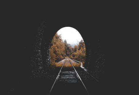 Train - low-light photo of railroad tunnel