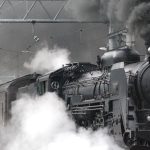Train - Black Train on Rail and Showing Smoke
