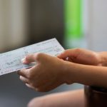Train Ticket - person holding white printer paper