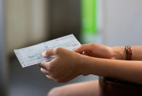 Train Ticket - person holding white printer paper