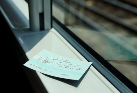 Train Ticket - white printer paper on glass window