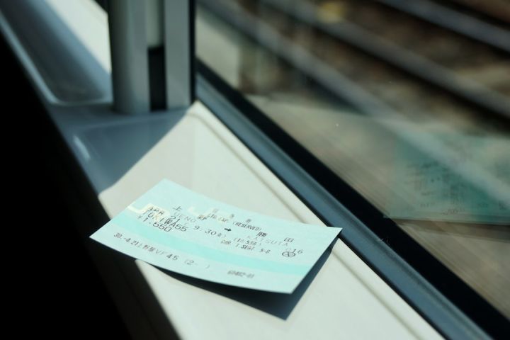 Train Ticket - white printer paper on glass window