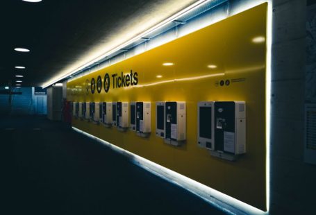 Train Ticket - yellow and white building during nighttime