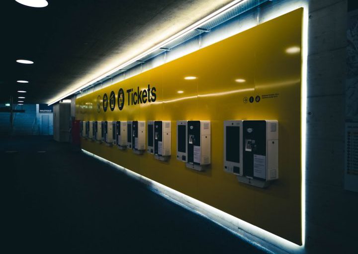 Train Ticket - yellow and white building during nighttime