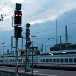 Train Ticket - white and red train on rail during daytime