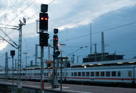 Train Ticket - white and red train on rail during daytime