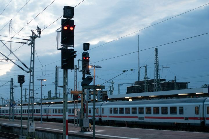 Train Ticket - white and red train on rail during daytime