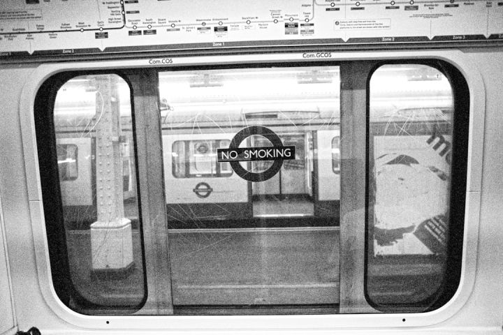 Train Ticket - grayscale photo of train with no smoking sticker