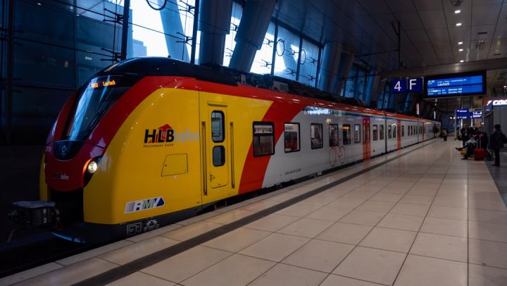 Train Ticket - yellow and red train in train station