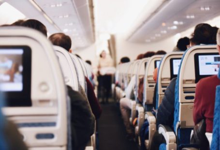 Train Ticket - shallow focus photography of people inside of passenger plane