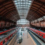 Train Station - red and white train in train station