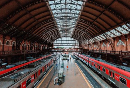 Train Station - red and white train in train station