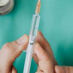 Health Emergencies - Person Holding A Vaccine