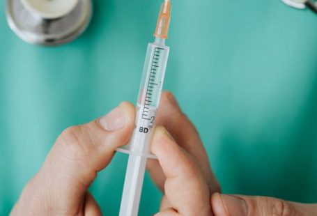 Health Emergencies - Person Holding A Vaccine