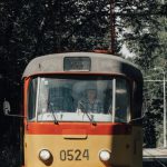 City Transport - Orange and White Tram on Rail Road