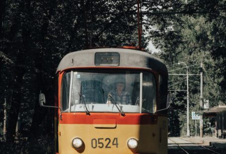 City Transport - Orange and White Tram on Rail Road