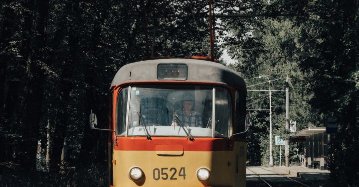 City Transport - Orange and White Tram on Rail Road
