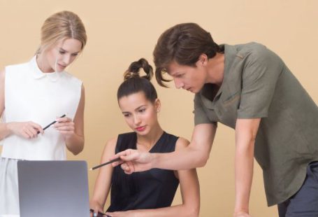Feedback - Colleagues Looking at Laptop
