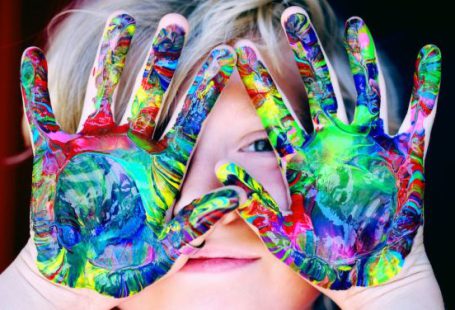 Kids - A KId With Multicolored Hand Paint