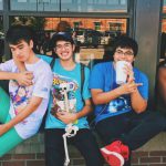 Teens - Four Men Sitting on Platform