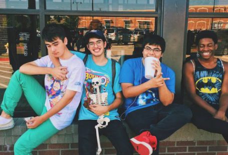 Teens - Four Men Sitting on Platform