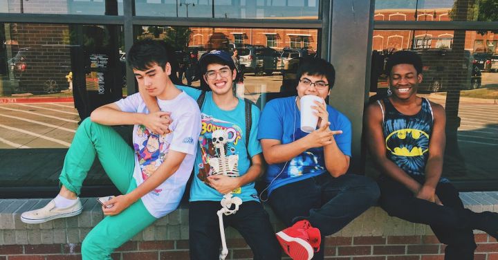 Teens - Four Men Sitting on Platform