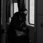 Fear Of Train Travel - A woman is sitting in a train car