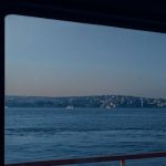 Window Seat - Red and Black Boat on Sea