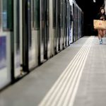 Train Travel Stories - Man in Black Jacket Walking on Hallway