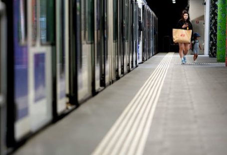 Train Travel Stories - Man in Black Jacket Walking on Hallway